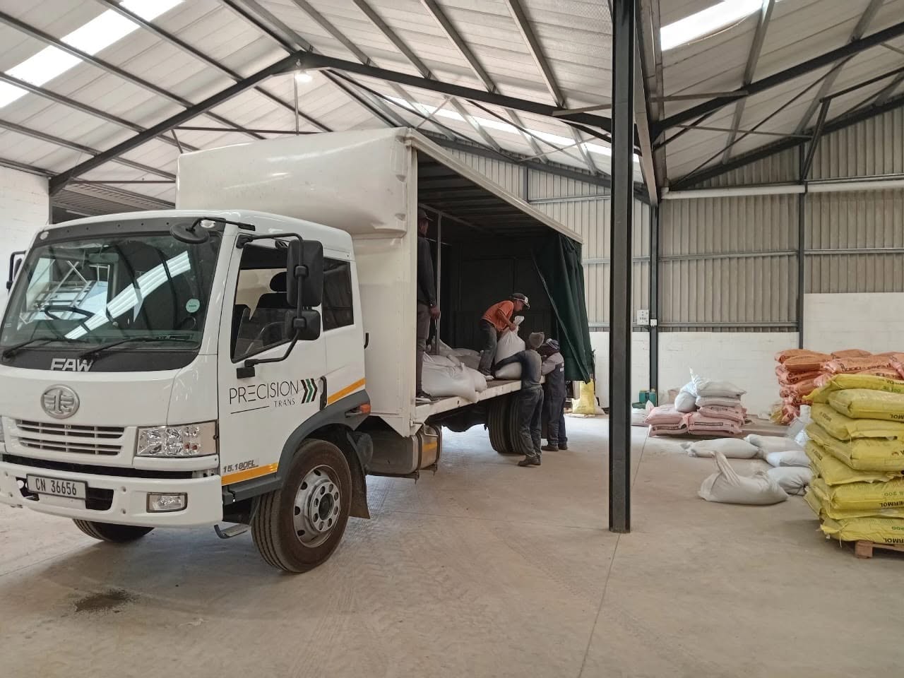 Loading feed bags — warehouse dispatch